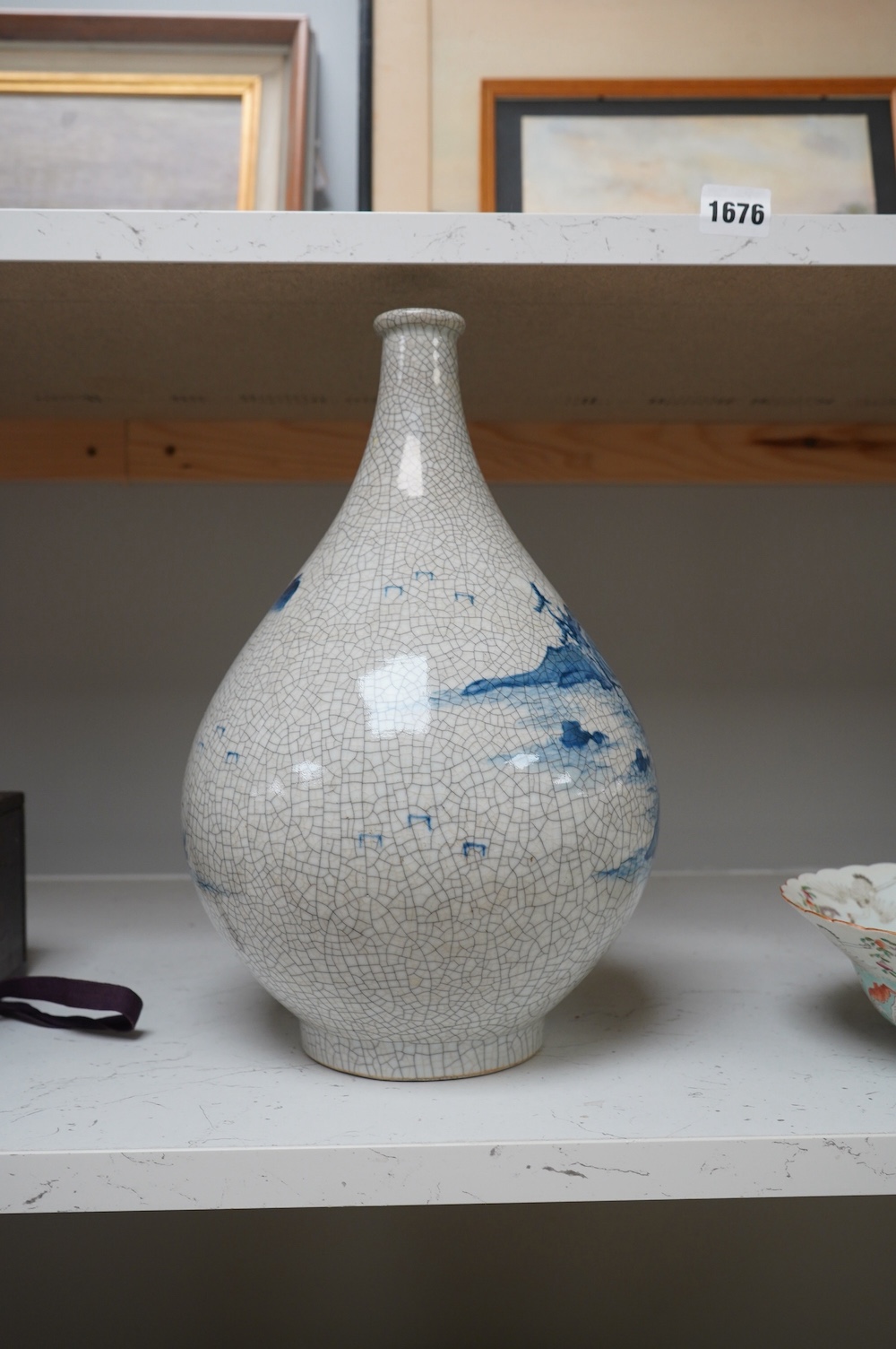 A Japanese blue and white crackle glaze bottle vase, 33cm. Condition - good